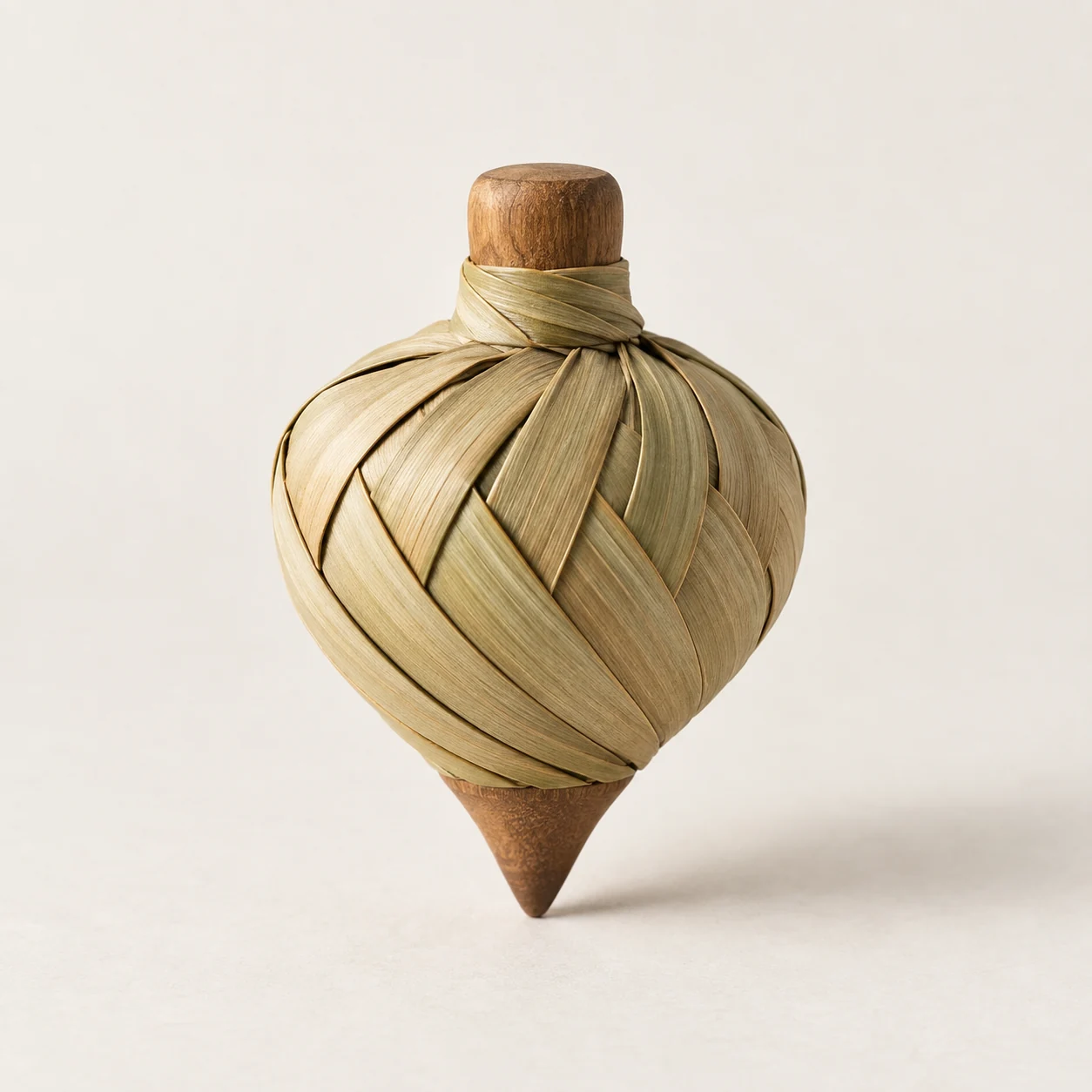 Peonza de palma. Imagen ilustrativa generada por IA; materiales: hoja de palma y madera.